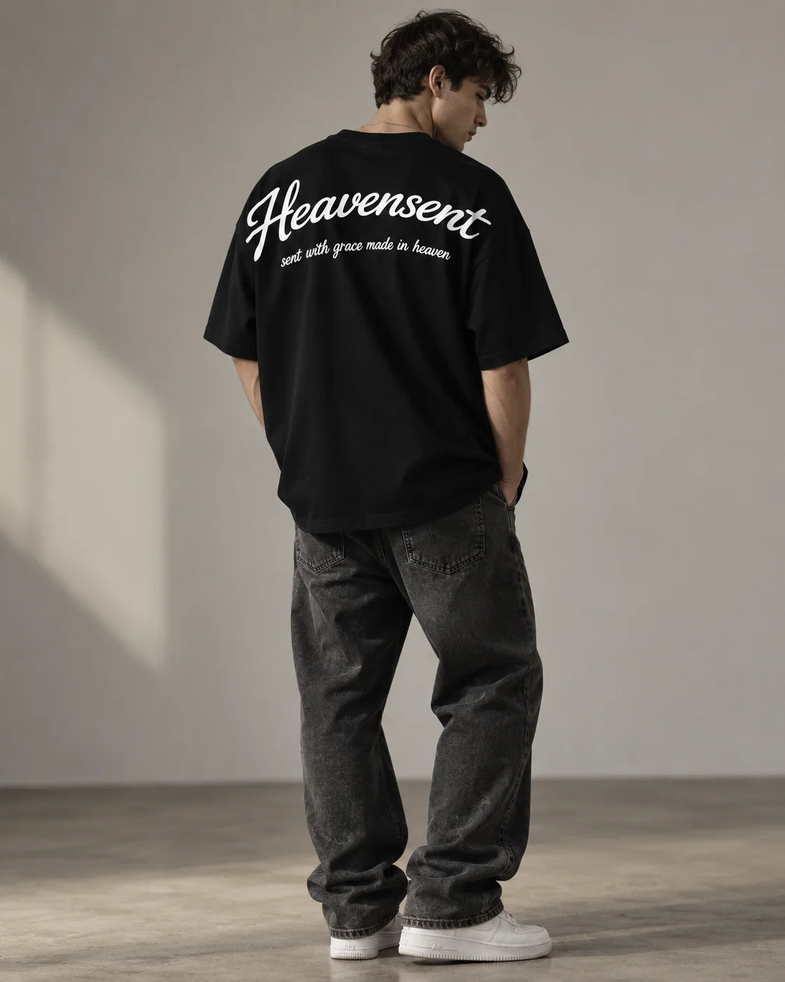 The Heavensent Oversized Tee in Black, shown from the back